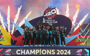 The White Ferns celebrate with the trophy after the ICC Women's T20 World Cup Final match.