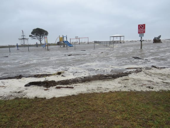 Flooding hits a playground on Carters Beach on the West Coast.