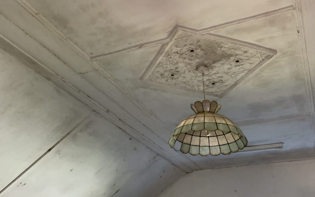 Black mould on the ceiling of the boarding house.