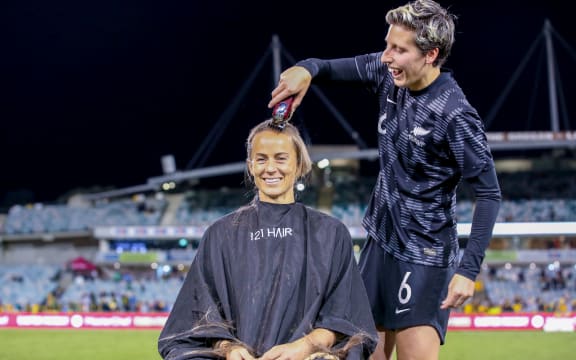 Rebekah Stott of the Football Ferns shaves Aivi Luik's head in support of brain tumour research after the International friendly match between the Australian Matildas and the New Zealand Football Ferns 2022.