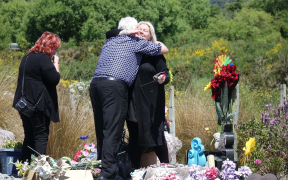 Sonya Rockhouse receives a hug from Bernie Monk at a memorial site for 29 men near the turnoff to the Pike River Mine. 
 


CONAN YOUNG / RNZ