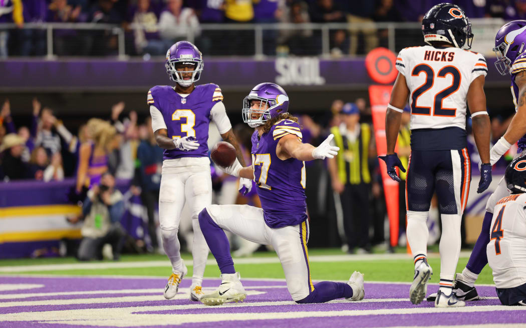 MINNEAPOLIS, MINNESOTA - NOVEMBER 27: T.J. Hockenson #87 of the Minnesota Vikings celebrates his touchdown against the Chicago Bears in the fourth quarter at U.S. Bank Stadium.