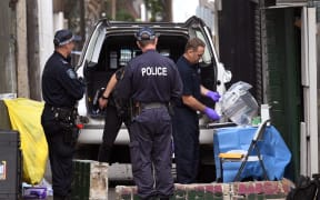 Police outside a house in Surry Hills, one of five raided in a counter-terror operation on Saturday.