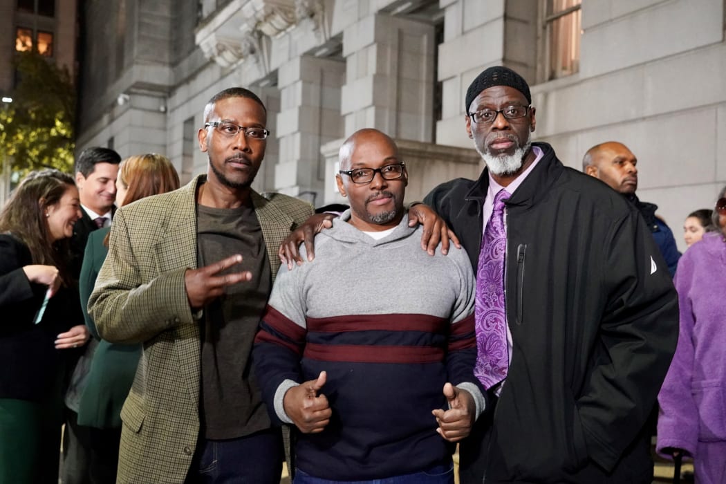 Alfred Chesnut, Andrew Stewart and Ransom Watkins pose for a photo after their liberation in Baltimore on November 25, 2019.