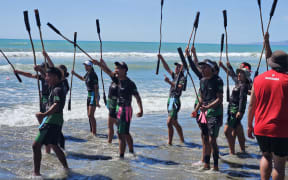Students at Wiki Hā perform a haka before begining a game of Hopu i te Ariki.
