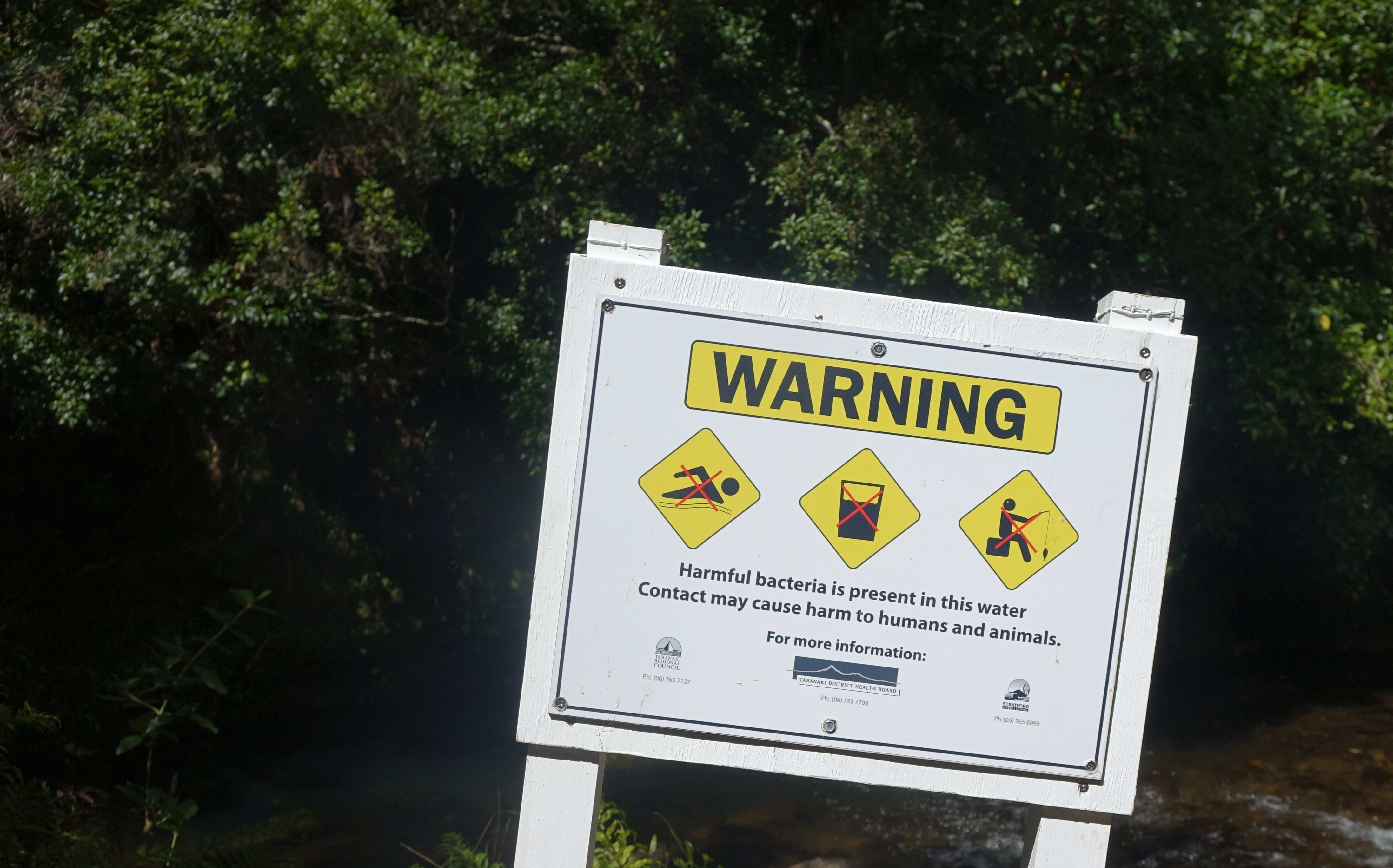 Signs warning people to stay out of the river went up in December