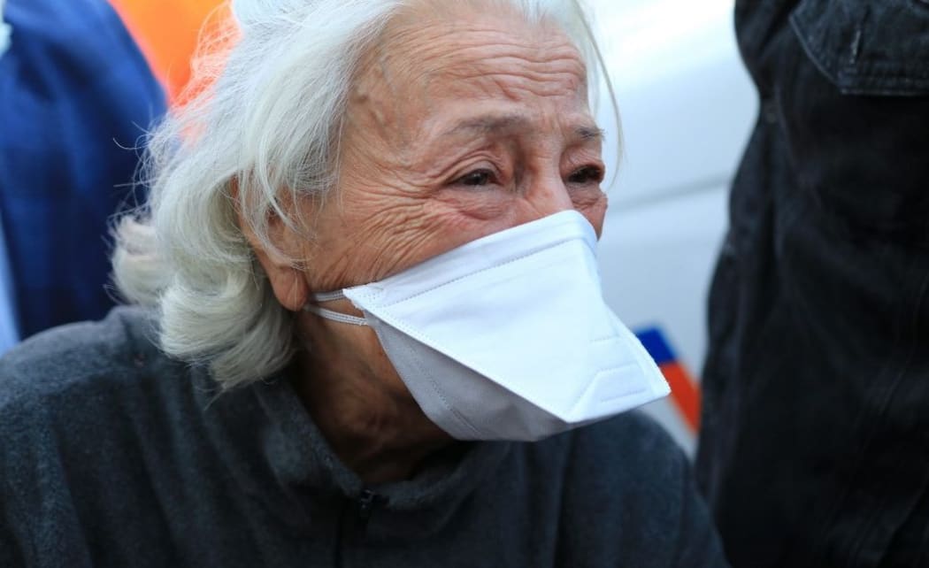 IZMIR, TURKEY - OCTOBER 31: Grandmother of Inci Okan gestures as search and rescue crews rescued 16 year-old Inci Okan from the rubbles of collapsed Riza Bey building 17 hours after a magnitude 6.6 quake shook Turkey's Aegean Sea coast, in Izmir, Turkey on October 31, 2020.