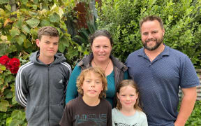 Melissa and Aaron Jacobson with their three children.