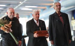 Dame Lynda Topp and her brother walk into the sound of bagpipes at the Celebration of Dame Jools Topp.