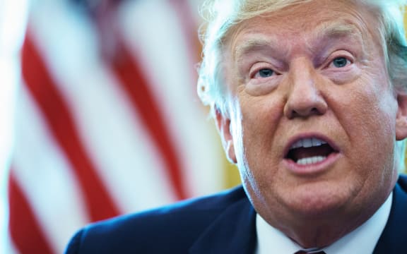US President Donald Trump in the Oval Office before signing an executive order for sanctions on Iran's supreme leader.