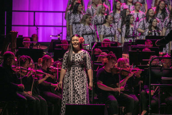 Signature Choir and the NZSO on stage at Spark Arena, Auckland.