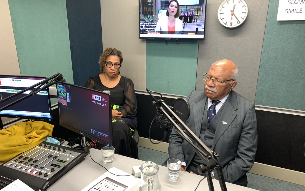 Fiji's first coup leader and former prime minister, Sitiveni Rabuka (R), and the deputy leader of his People's Alliance Party, Lyndah Tabuya (L), during an interview with Radio New Zealand Pacific in Auckland. June 2022