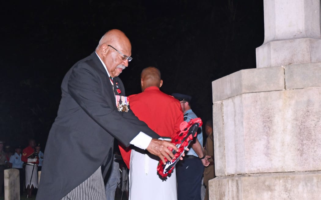 Fiji's prime minister, Sitiveni Rabuka lays a wreath during the ANZAC Day dawn ceremony in Suva