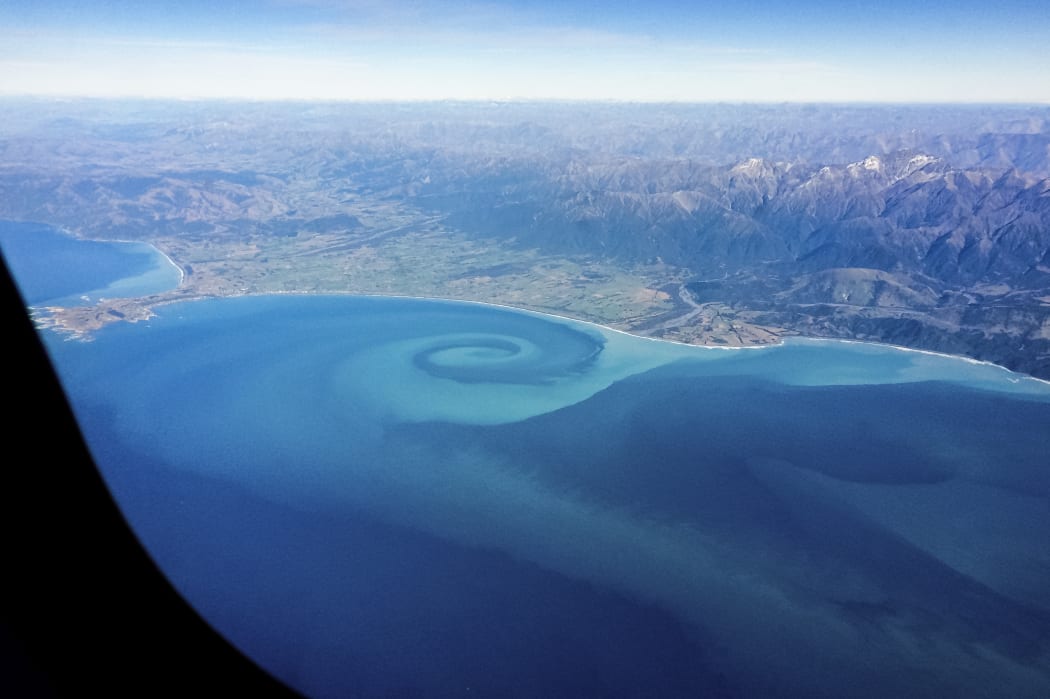The Hapuku River, on the Kaikoura Coast, creates a giant eddy swirl as it mixes with sea water.