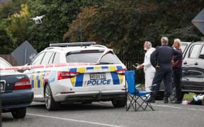 Forensic scene examiners at the scene of a brawl in Gisborne, which led to the death of two.