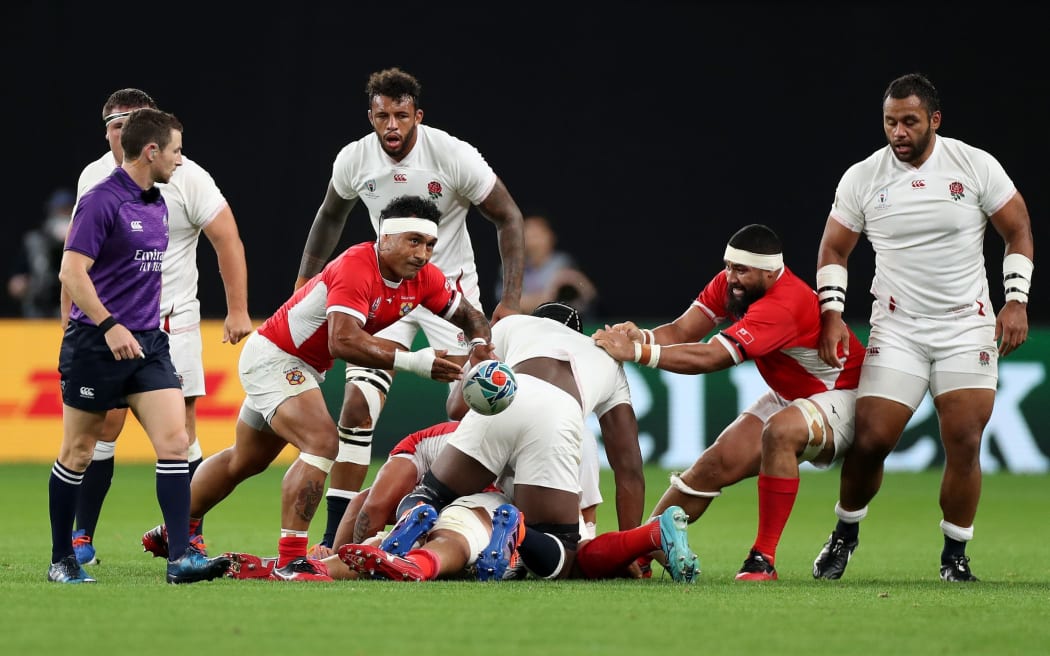 Tonga halfback Sonatane Takulua passes the ball during the 2019 Rugby World Cup match against England.
