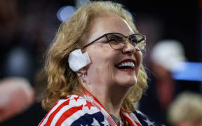 MILWAUKEE, WISCONSIN - JULY 17: Arizona delegate Susan Ellsworth wears a 'bandage' on her ear on the third day of the Republican National Convention at the Fiserv Forum on July 17, 2024 in Milwaukee, Wisconsin. Delegates, politicians, and the Republican faithful are in Milwaukee for the annual convention, concluding with former President Donald Trump accepting his party's presidential nomination. The RNC takes place from July 15-18.   Joe Raedle/Getty Images/AFP (Photo by JOE RAEDLE / GETTY IMAGES NORTH AMERICA / Getty Images via AFP)