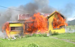The fire began yesterday afternoon, at Chris' home in Takaka.