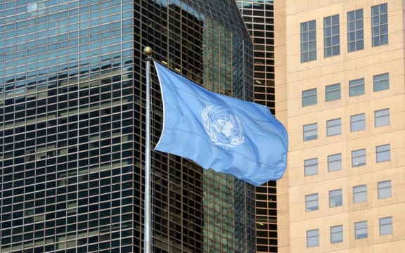 The UN flag flies outside the United Nations General Assembly Hall in New York City.