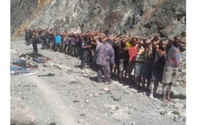 This photo released by Papua New Guinea police on Oct. 13 shows dozens of illegal miners arrested near the Porgera Gold Mine in Enga province, Papua New Guinea. [Handout/PNG Police]