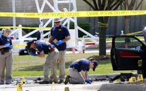 The crime scene before the removal two bodies outside of the Curtis Culwell Center in Garland.