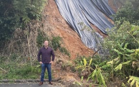 Peter Mckay beneath a slip in Titirangi