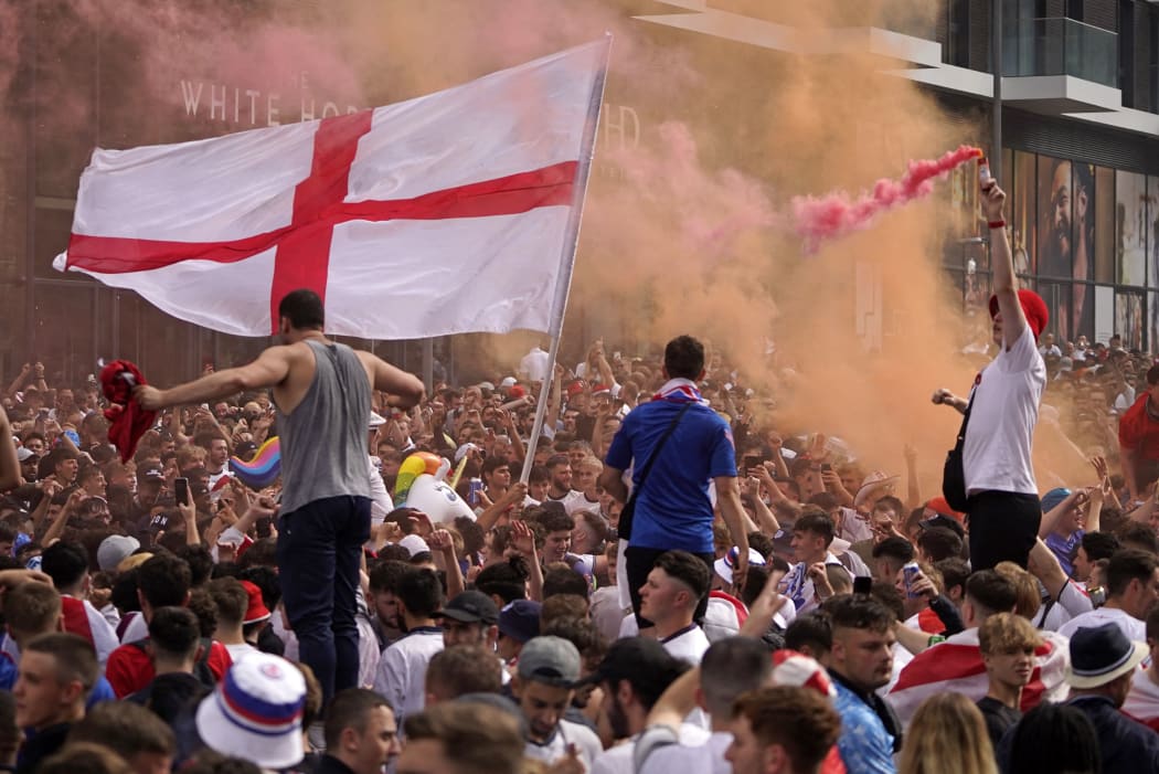 England fans cheer on their team outside Wembley Stadium ahead of the UEFA EURO 2020 final football match between England and Italy