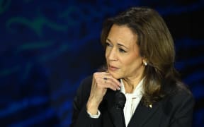 US Vice President and Democratic presidential candidate Kamala Harris listens to former US President and Republican presidential candidate Donald Trump speak during a presidential debate at the National Constitution Center in Philadelphia, Pennsylvania, on September 10, 2024. (Photo by SAUL LOEB / AFP)