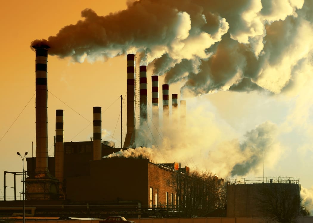 A file photo representing industry emissions, showing factory smoke.