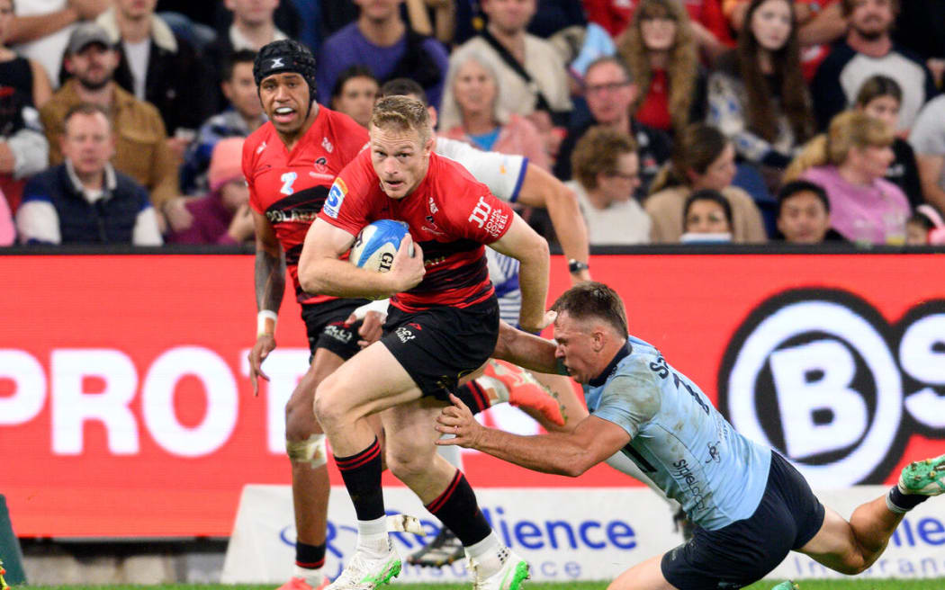 Johnny McNicholl scores against the Waratahs.