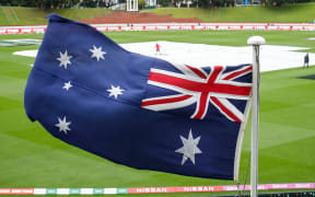 Australian flag in strong winds at the Basin Reserve in Wellington