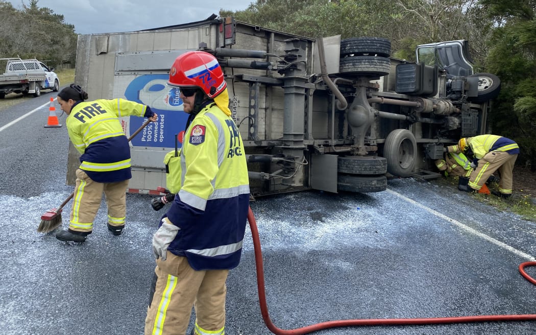 State Highway 1 was blocked north of Kaitāia after a milk delivery truck rolled Friday.