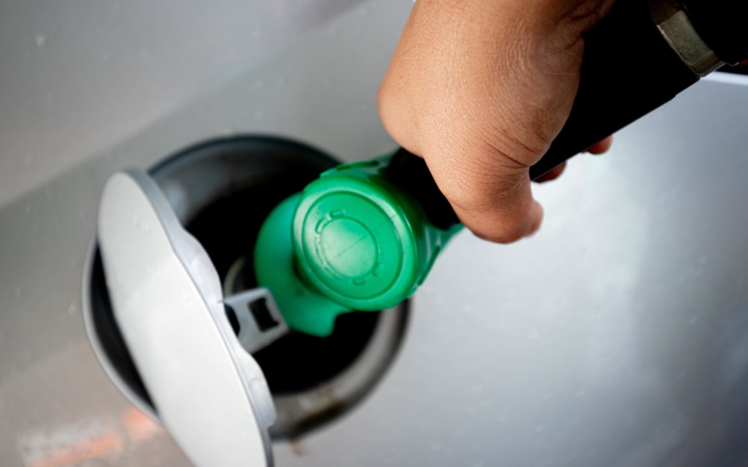 A person filling up petrol