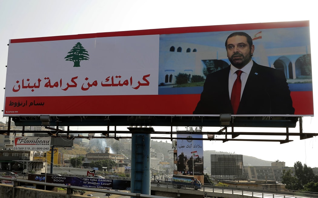 An image in Beirut of Lebanese Prime Minister Saad Hariri on a giant billboard reading "your dignity is Lebanon's dignity.