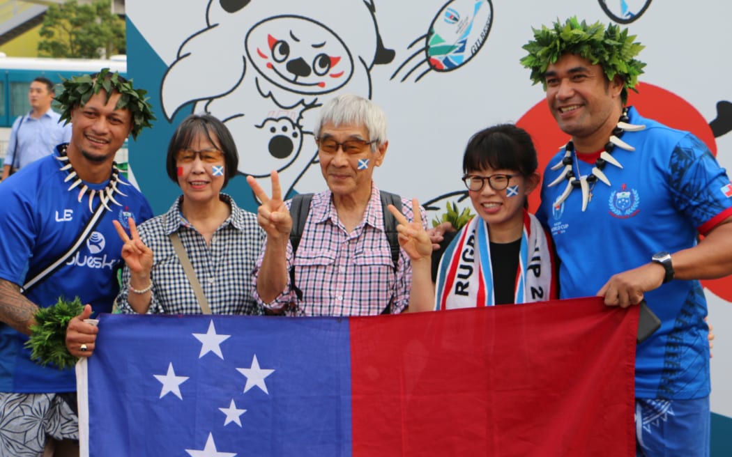 Bistol Sefa, right, and other RWC fans in Kobe