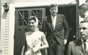 Keeping a watchful eye as Presidentand Mrs. Kennedy exit St. FrancisXavier Church in Hyannis Port.