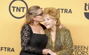 Carrie Fisher, left, and her mother Debbie Reynolds.