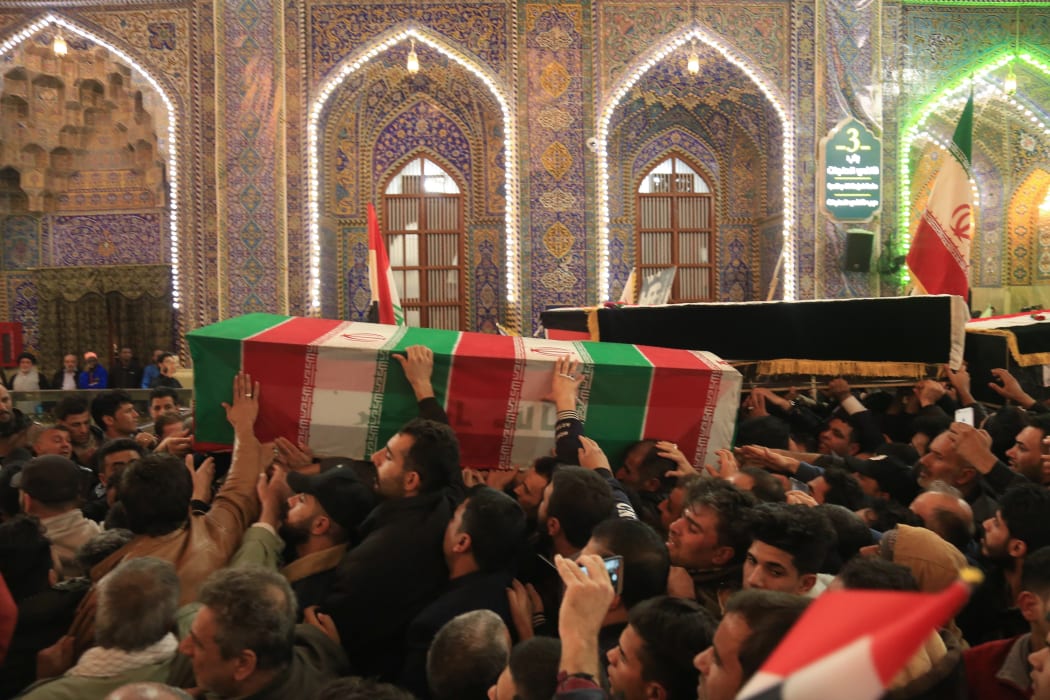 Mourners carry the coffins of slain Iraqi paramilitary chief Abu Mahdi al-Muhandis, Iranian military commander Qasem Soleimani and eight others inside the Shrine of Imam Hussein in the holy Iraqi city of Karbala during a funeral procession on 4 January.
