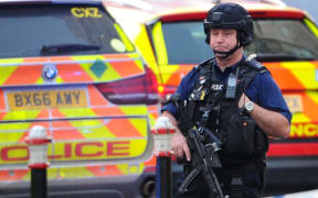 An armed police officer covers a cordon near London Bridge in London, on November 29, 2019 after reports of shots being fired on London Bridge.