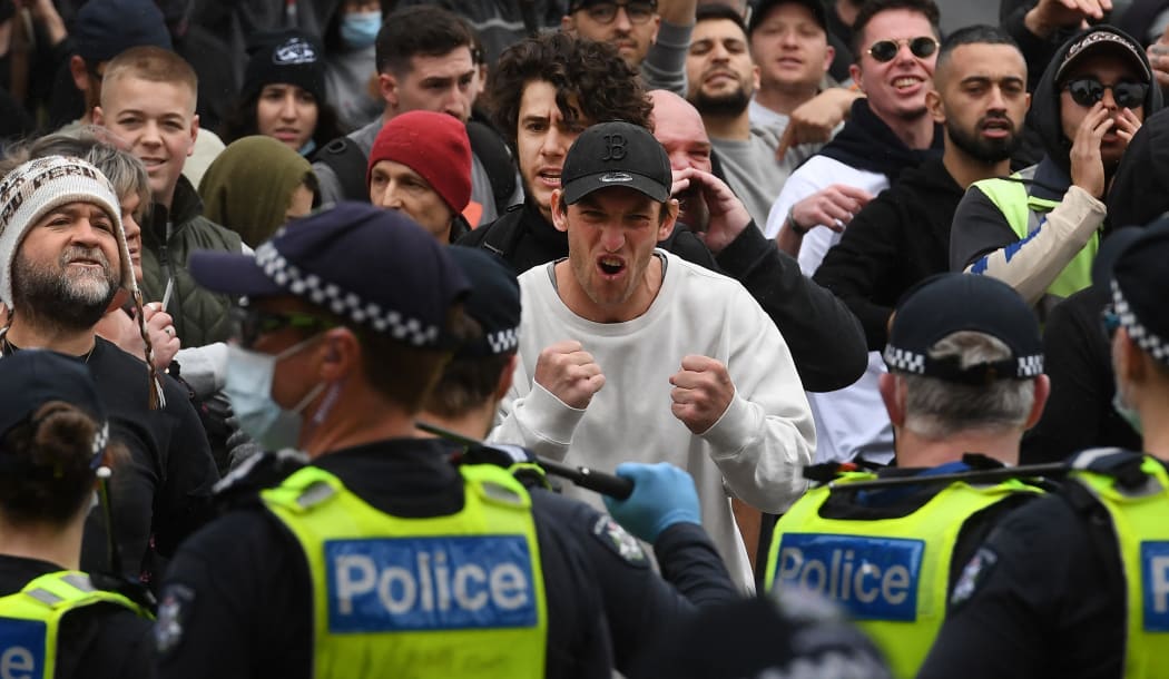 Protesters march through the streets during an anti-lockdown rally in Melbourne on 18 September.