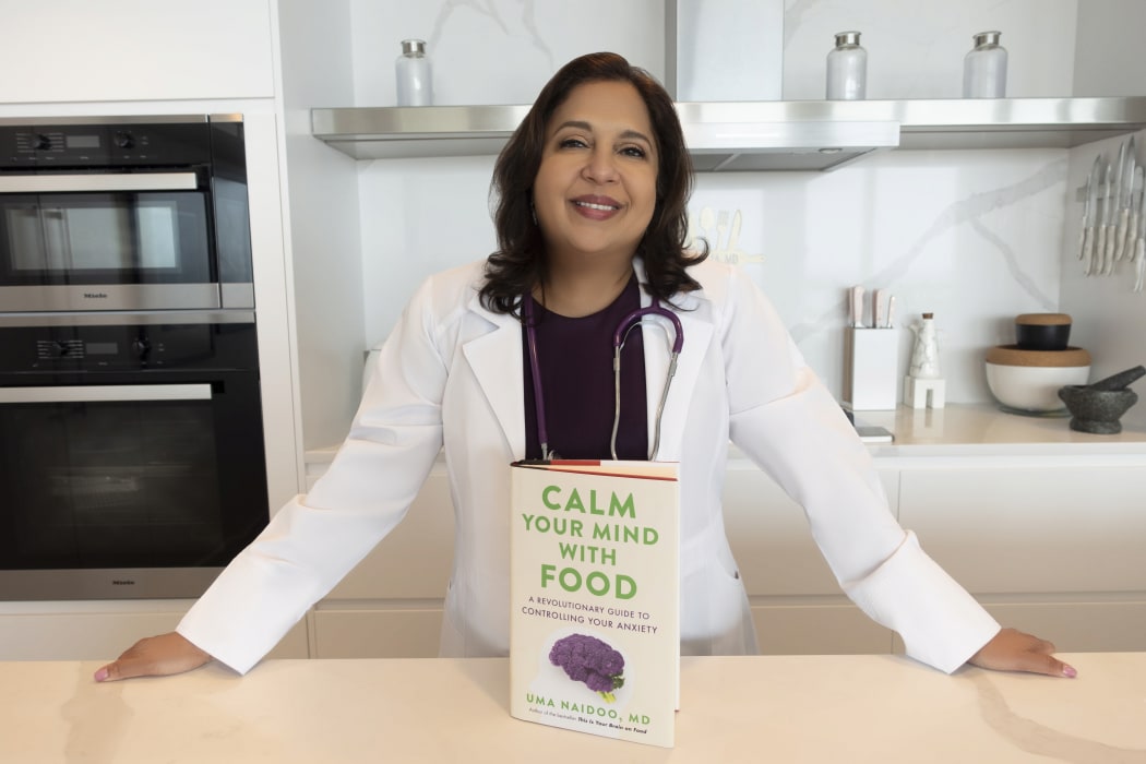 Dr Uma Naido with her book, Calm Your Mind with Food