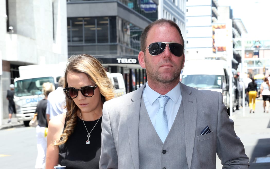 Finn Batato and his wife Anastasia arrive at court to hear the judges decision for an extradition case  in Auckland on December 23, 2015. A New Zealand judge ruled December 23 Internet mogul Kim Dotcom can be extradited to the United States where he is wanted on money laundering, racketeering and breach of copyright charges. Dotcom and three others - Mathias Ortmann, Bram van der Kolk and Finn Batato - were arrested on charges of criminal copyright violation back in 2012. AFP PHOTO / Michael Bradley (Photo by MICHAEL BRADLEY / AFP)