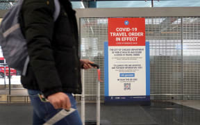 A traveller passes through O'Hare International Airport in Chicago, Illinois, in November 2020.