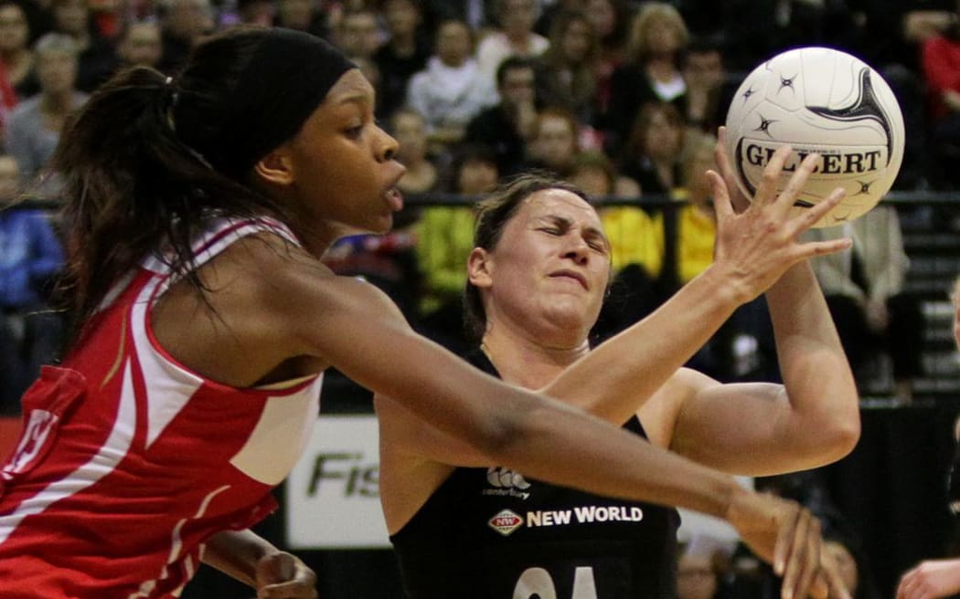 Silver Ferns shooter Jodi Brown tangles with England's Eboni Beckford-Chambers during the 2012 New World Quad Series at TSB Bank Arena, Wellington, New Zealand on Thursday 25 October 2012. Photo: Justin Arthur / photosport.co.nz