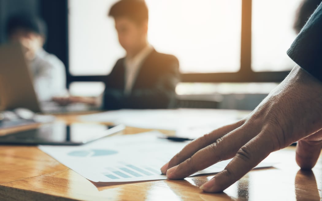 Manager hand on the table with being stressed about the work of the staff.