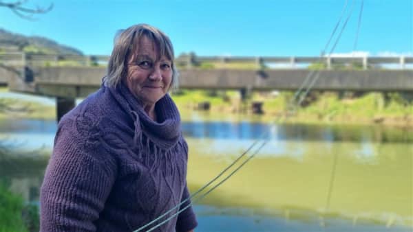 Waitara's Bronwyn Brown accesses her stand from a track besides State Highway 3.