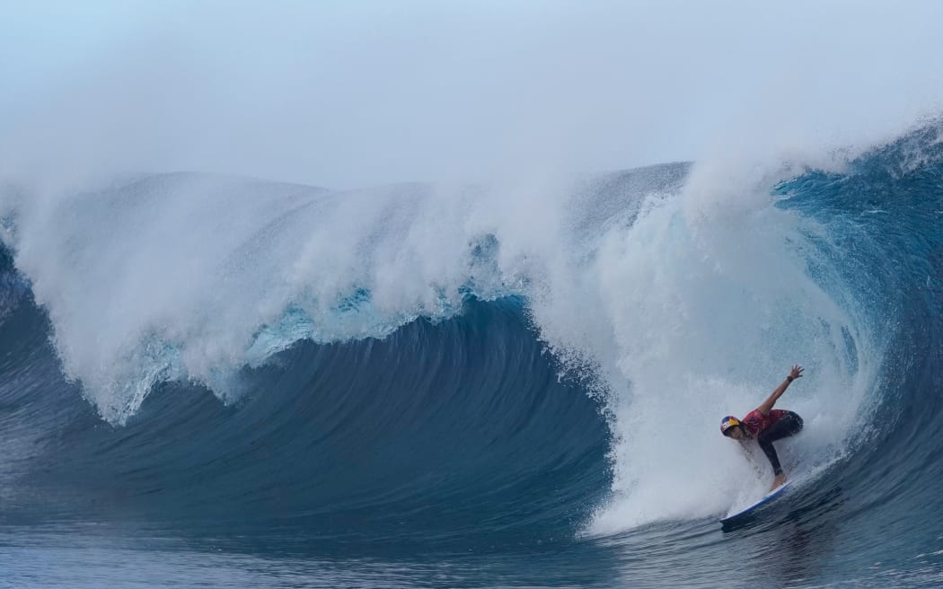 Australian surfer Molly Picklum rides a wave at Teahupo'o in Tahiti, French Polynesia on August 11, 2023, during the heat 1 of the WSL Shiseido Tahiti pro surfing event. Teahupo'o will host the surfing event of the Paris 2014 Olympic Games.