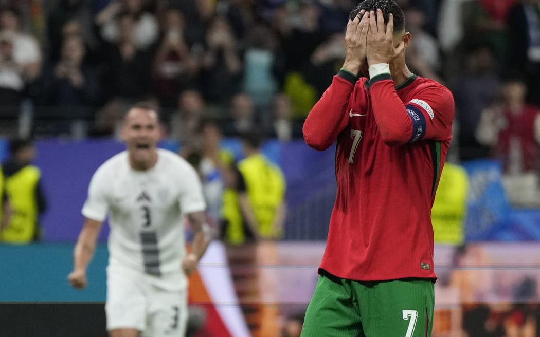 Portugal's Cristiano Ronaldo reacts after he failed scoring a penalty during a round of sixteen match between Portugal and Slovenia at the Euro 2024 soccer tournament in Frankfurt, Germany, Monday, July 1, 2024.
