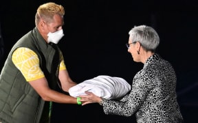 The Commonwealth Flag is handed over to the Governor of Victoria Linda Dessau during the Closing Ceremony of the XXII Commonwealth Games in Birmingham, England.