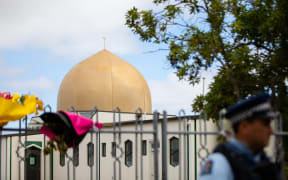 One week after the Christchurch terror attacks people gather outside the Al Noor Mosque to pay their respects.